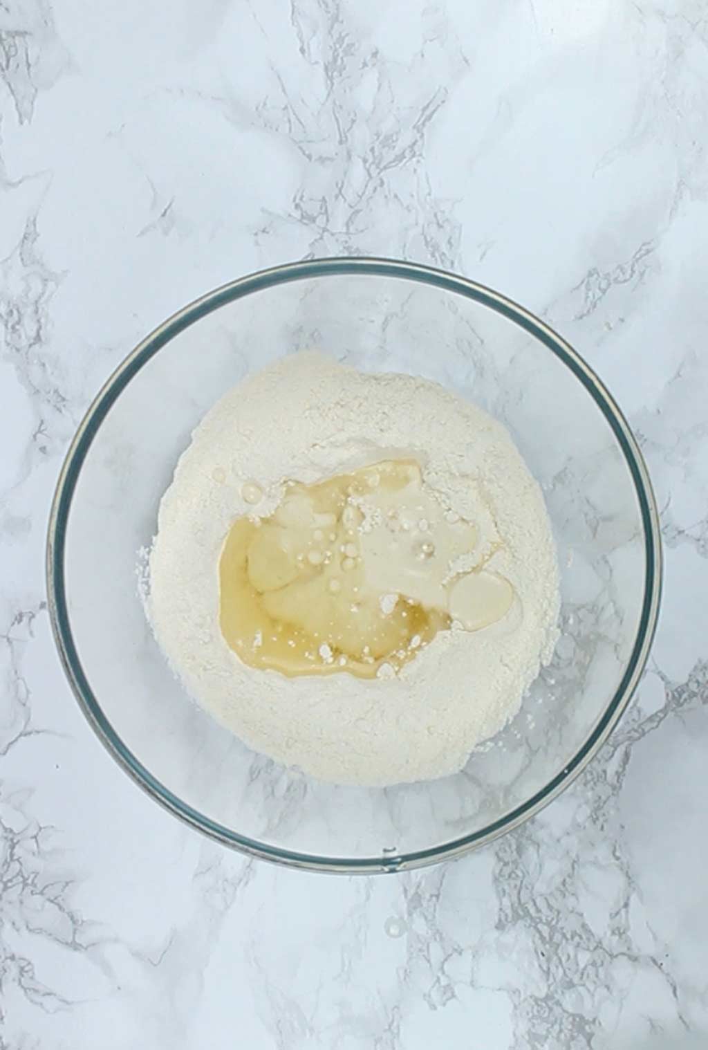 overhead shot of the wet and dry ingredients in a bowl