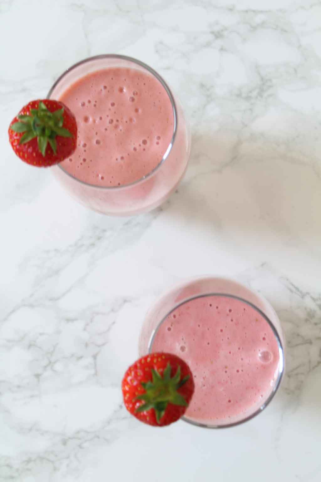 overhead shot of two Vegan Strawberry Milkshakes