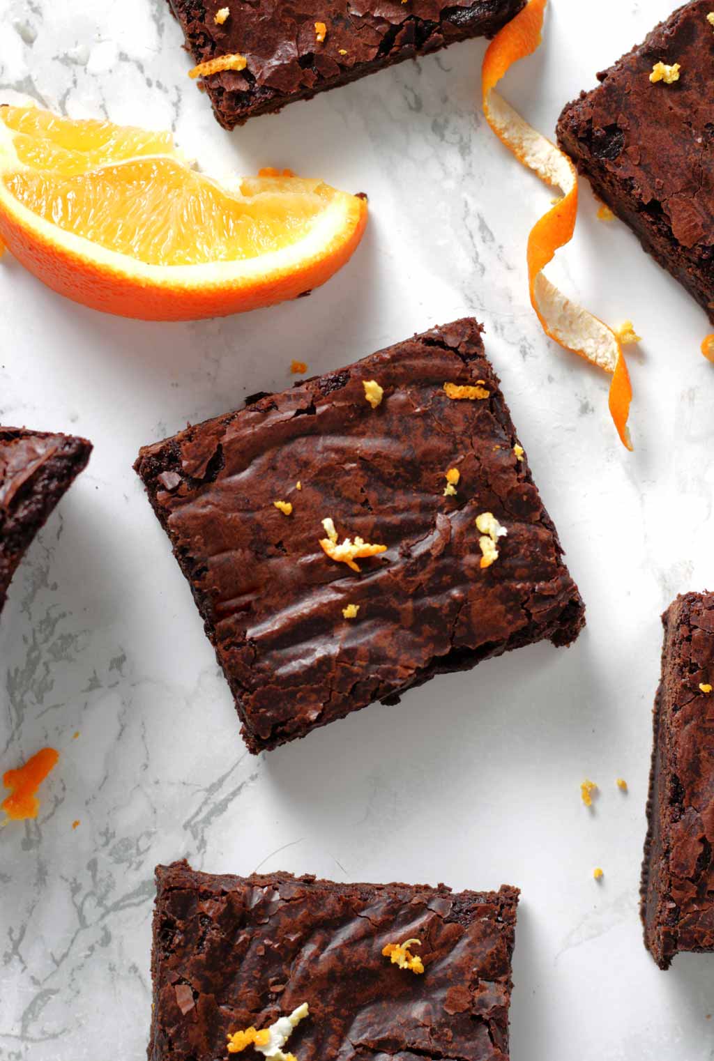 Overhead Shot Of Vegan Chocolate Orange Brownies And A Wedge Of Orange