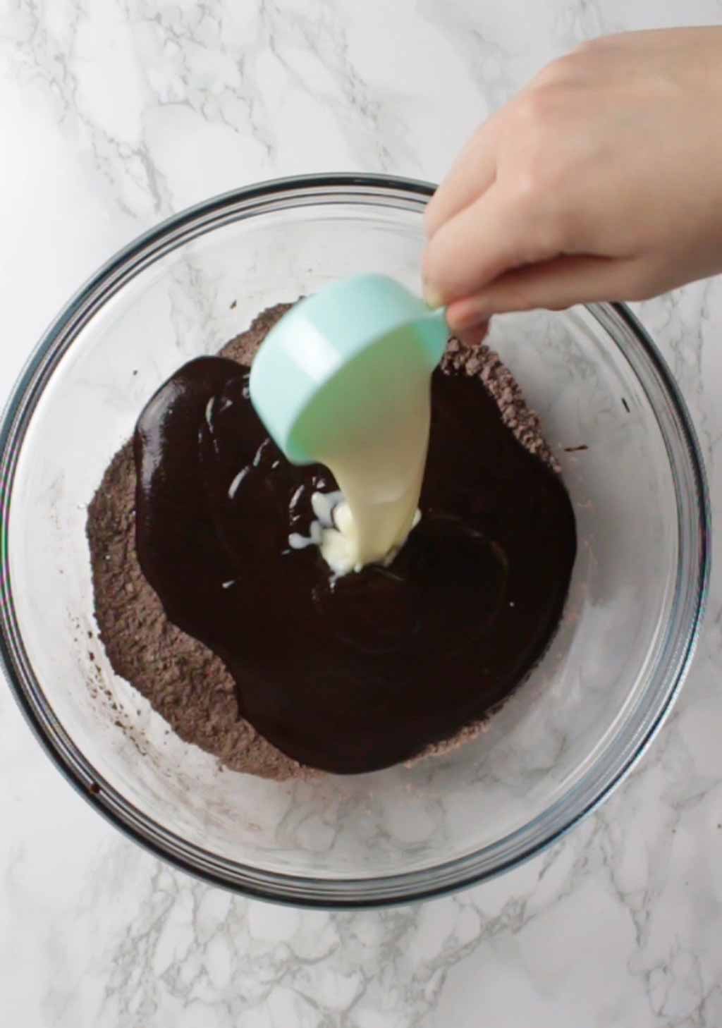 Pouring Milk Into The Bowl