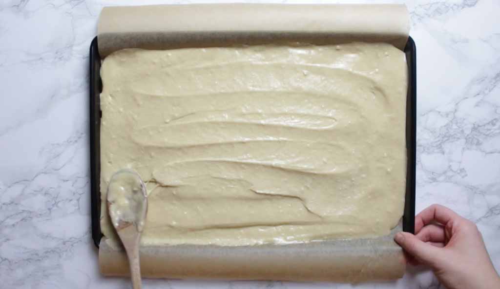Smoothing The Cake Batter Into The Tray