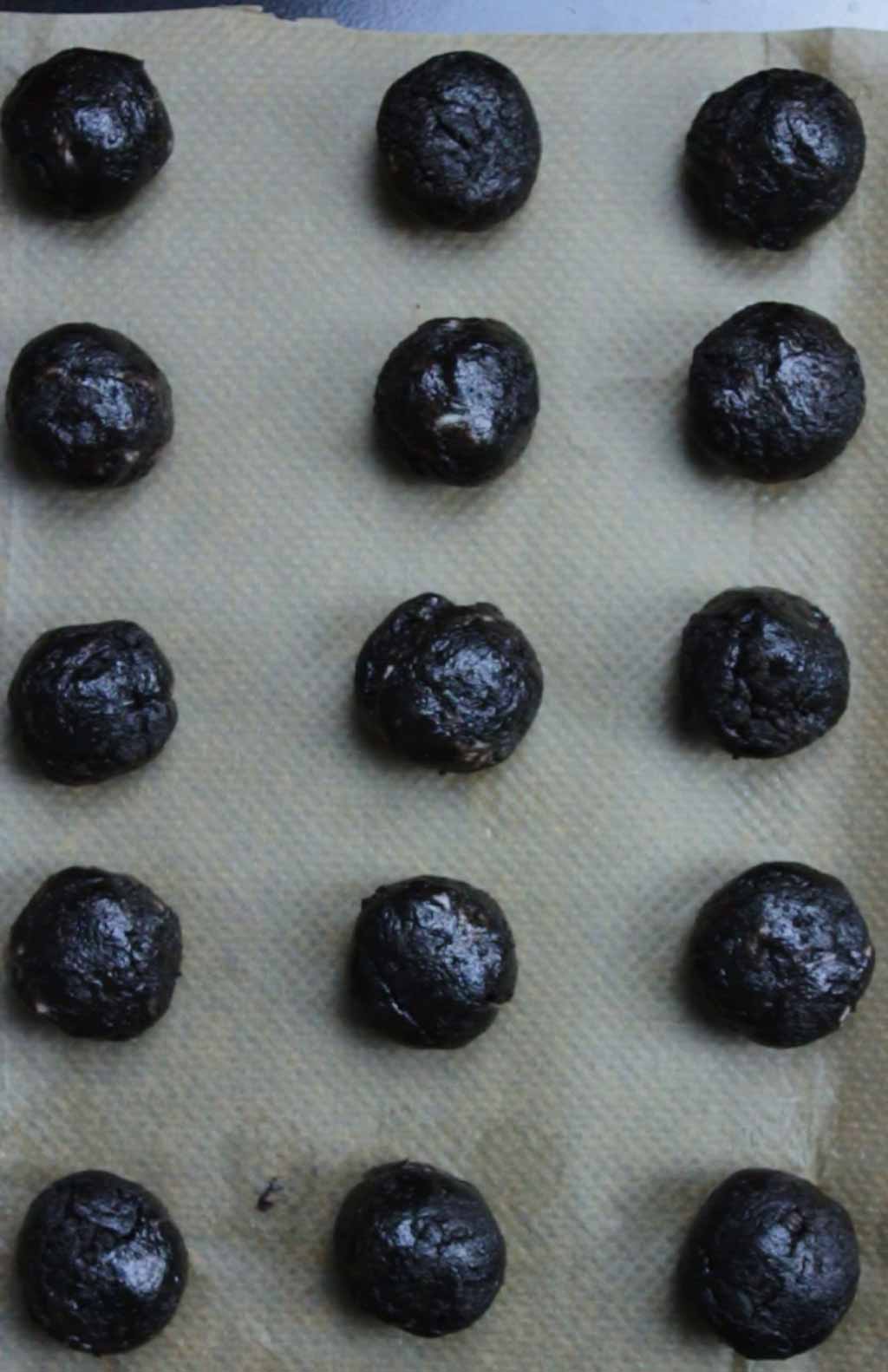 Oreo Cookie Balls On A Lined Baking Tray