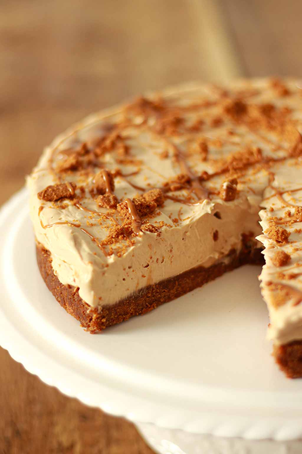 Biscoff Cheesecake With A Slice Taken Out Of It
