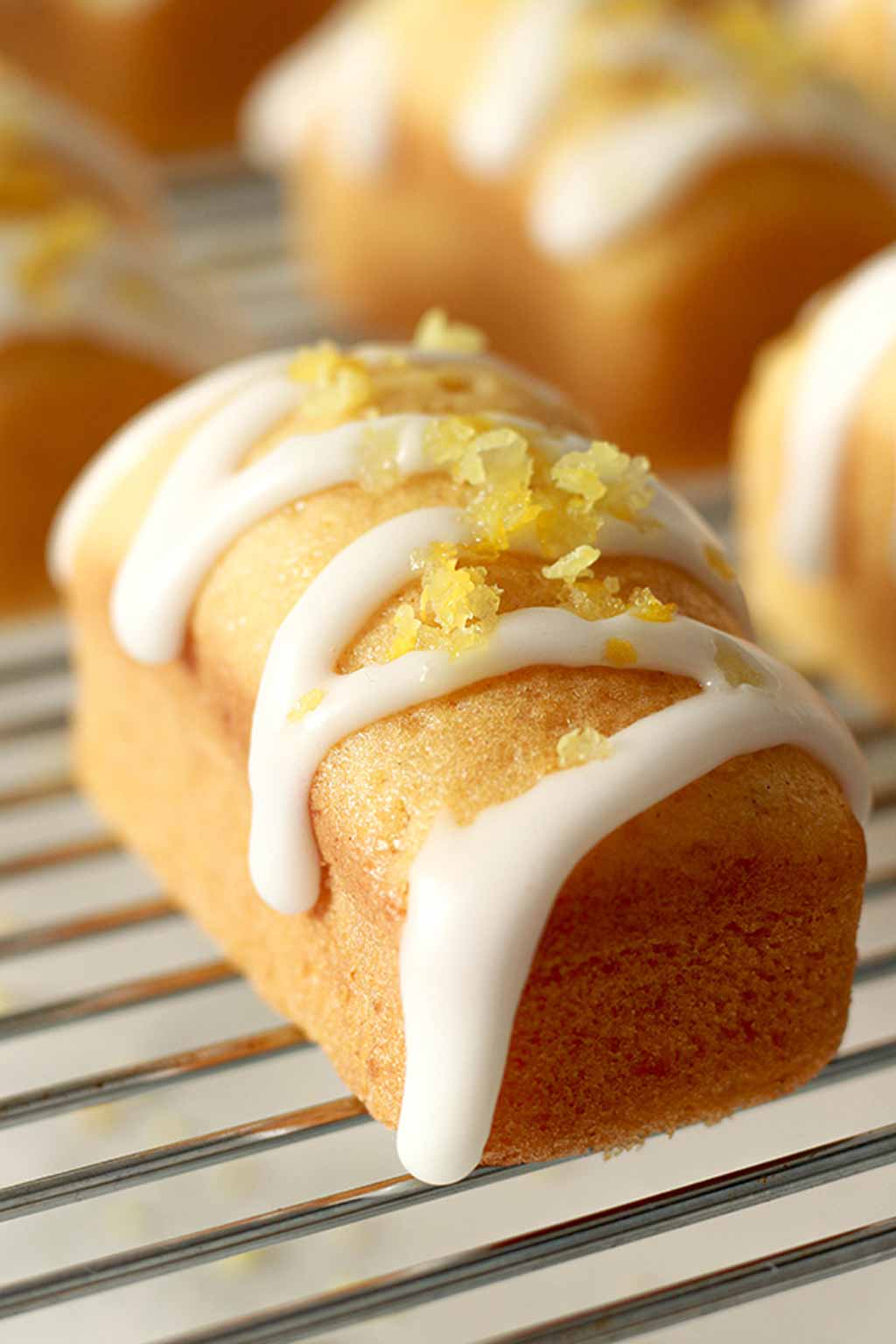 Mini Vegan Lemon Loaf With Icing And Lemon Zest On Top