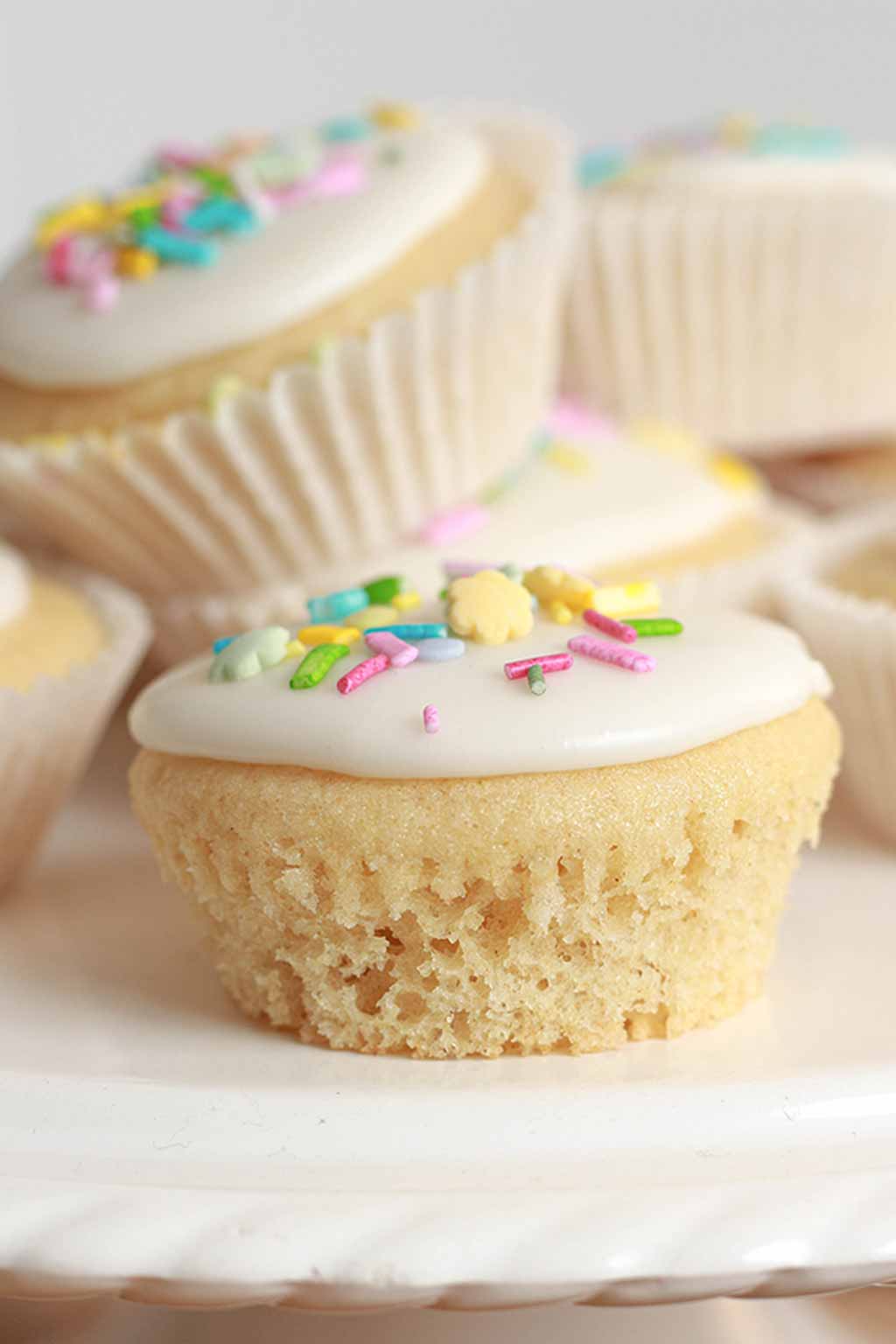 fairy cakes on a white cake stand