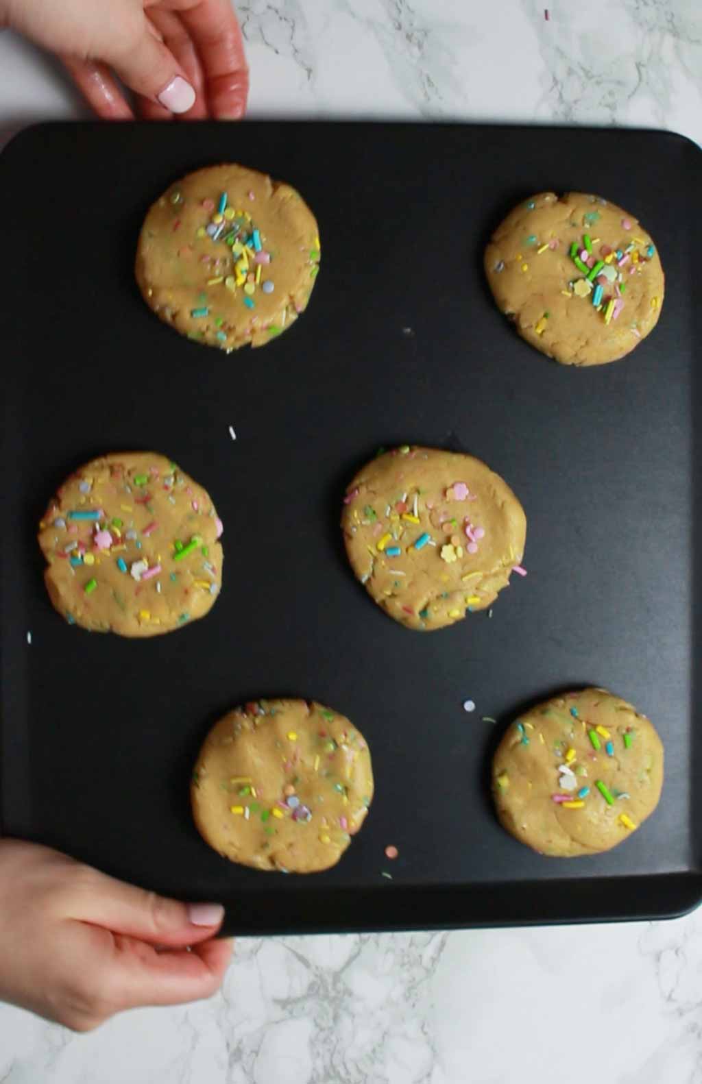 vegan cookie dough discs with sprinkles on top