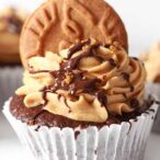 chocolate cupcake topped with Biscoff icing and chocolate sauce