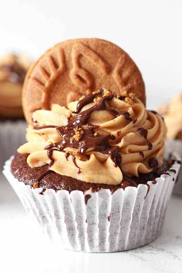 chocolate cupcake topped with Biscoff icing and chocolate sauce