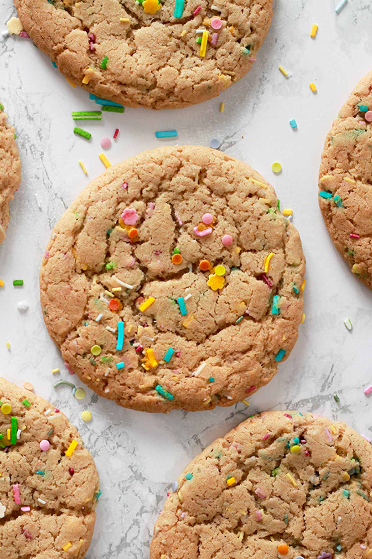 Vegan Funfetti Cookies Laying Flat On A White Background