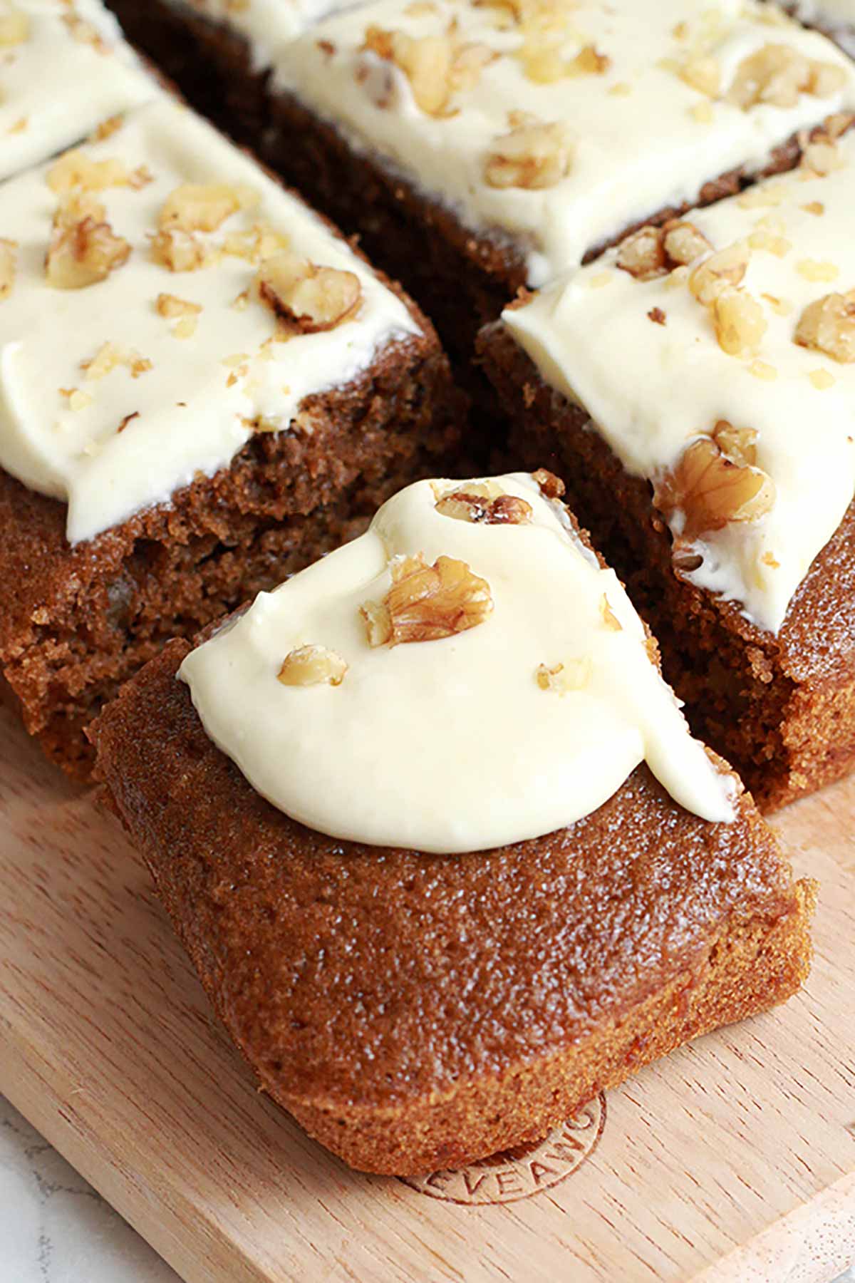 Coffee Cake With Cream Cheese Frosting And Walnuts On Top