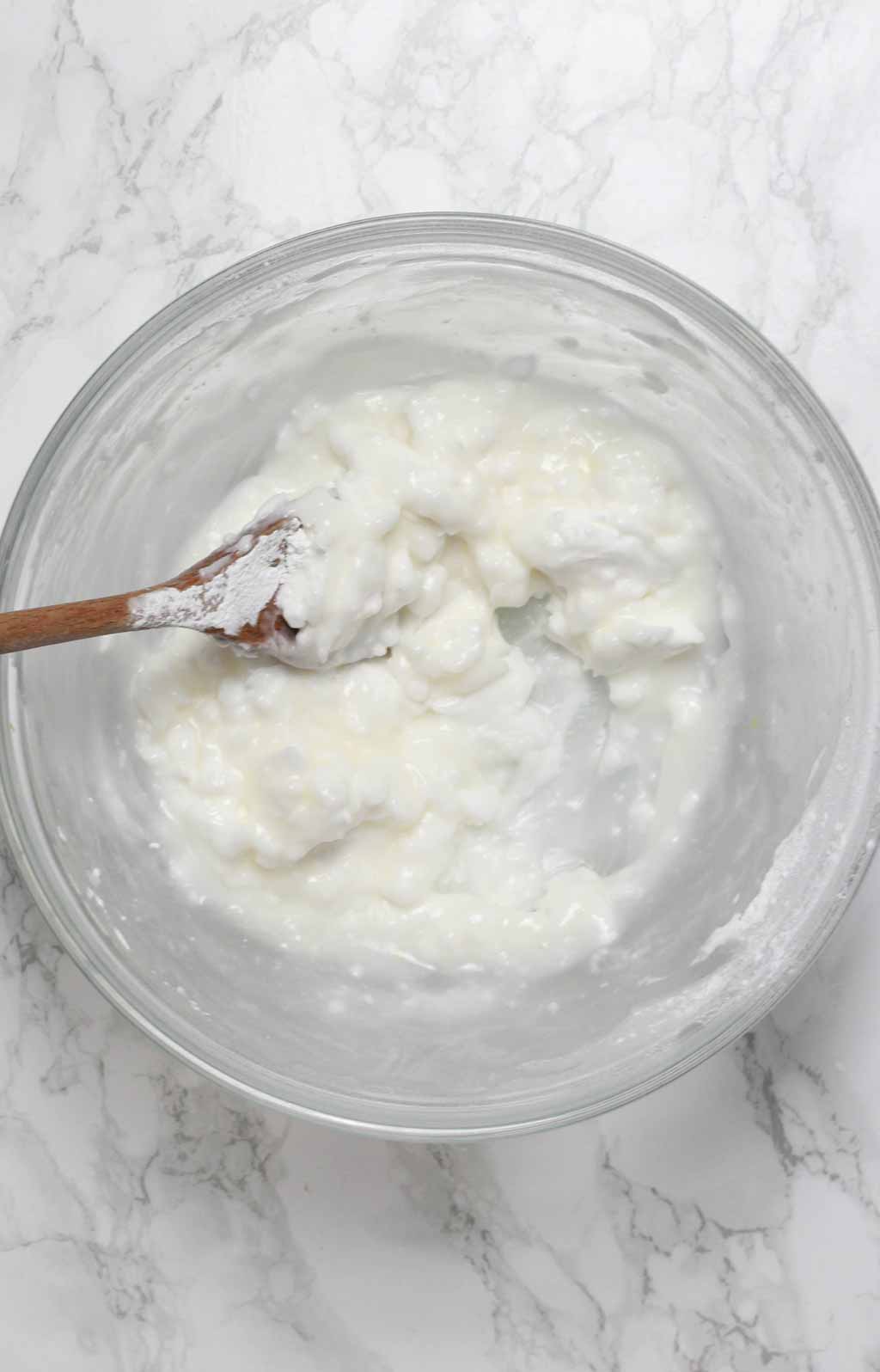 Cream cheese And Icing Sugar Mixed Together In A Bowl