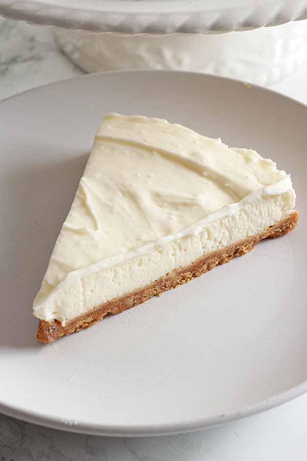 Slice Vegan Vanilla Cheesecake On A White Plate
