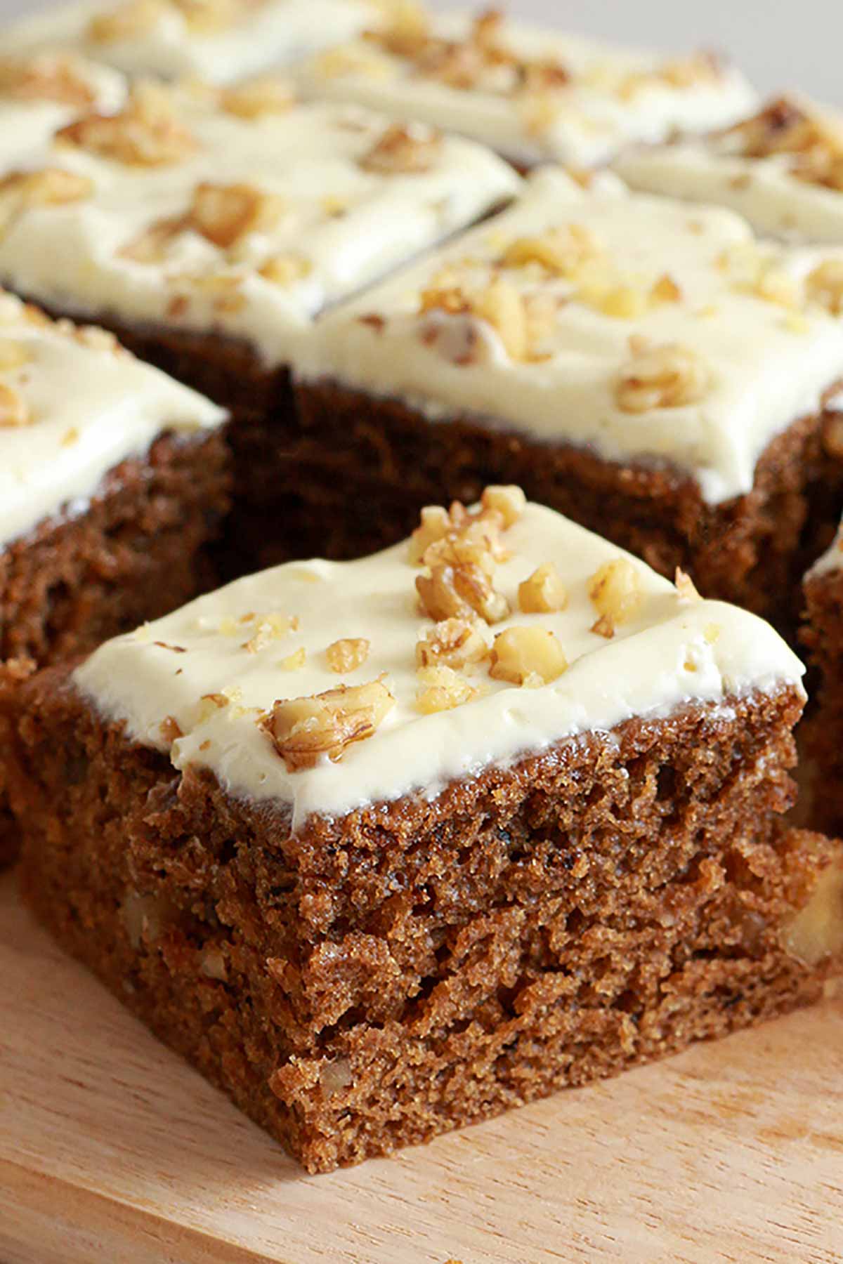 Slices Of Coffee And Walnut Cake On A Wooden Board