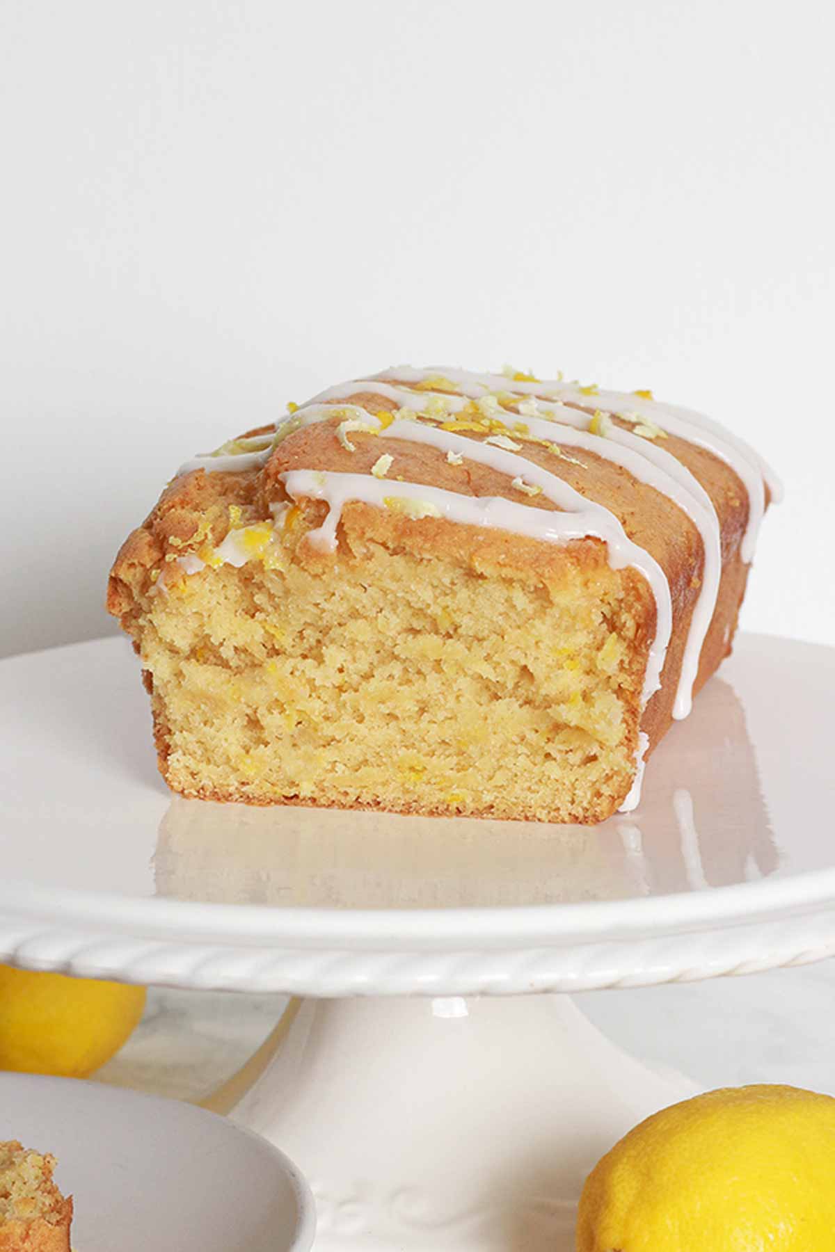 Lemon Loaf Cake On A White Cake Stand