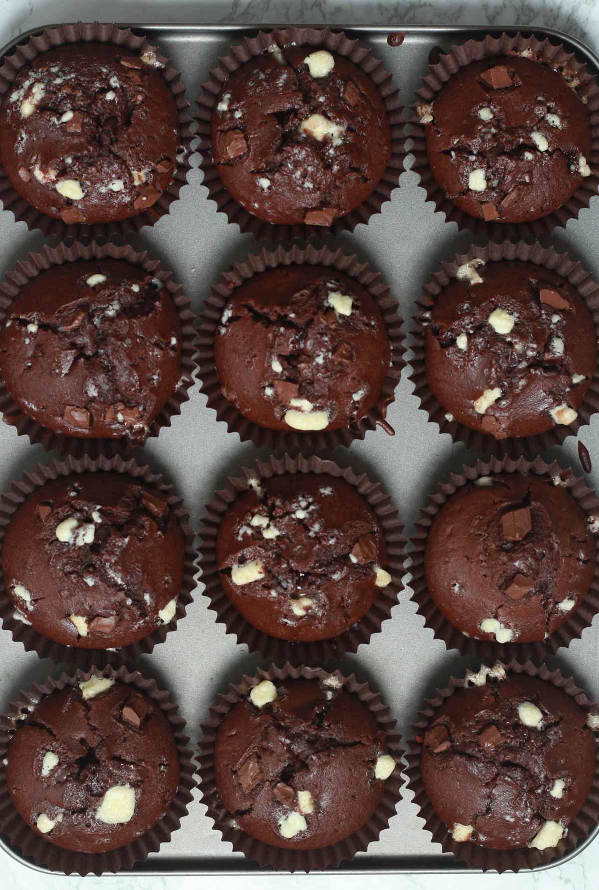 12 Baked Chocolate Muffins In A Tray