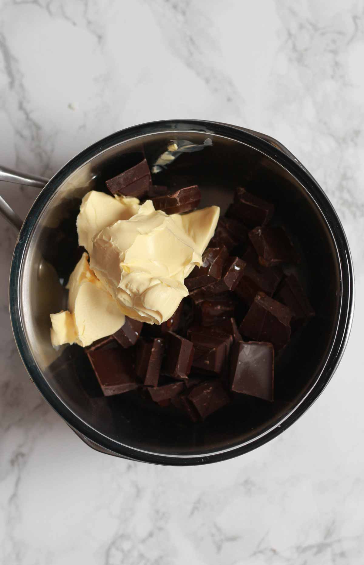 Bowl Of Chocolate And Margarine Over A Pan Of Water