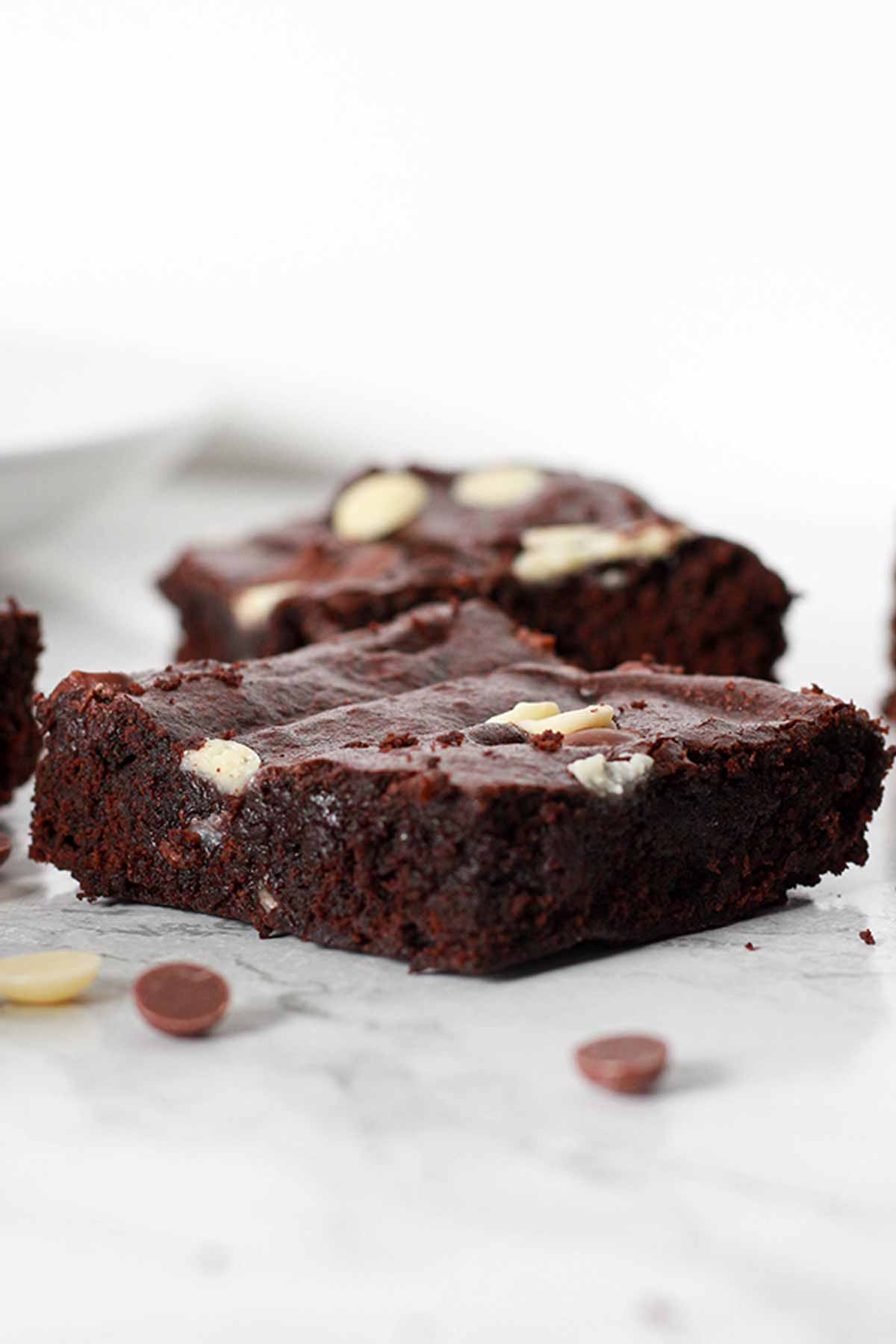 Squares Of Brownie Laying On A White Surface