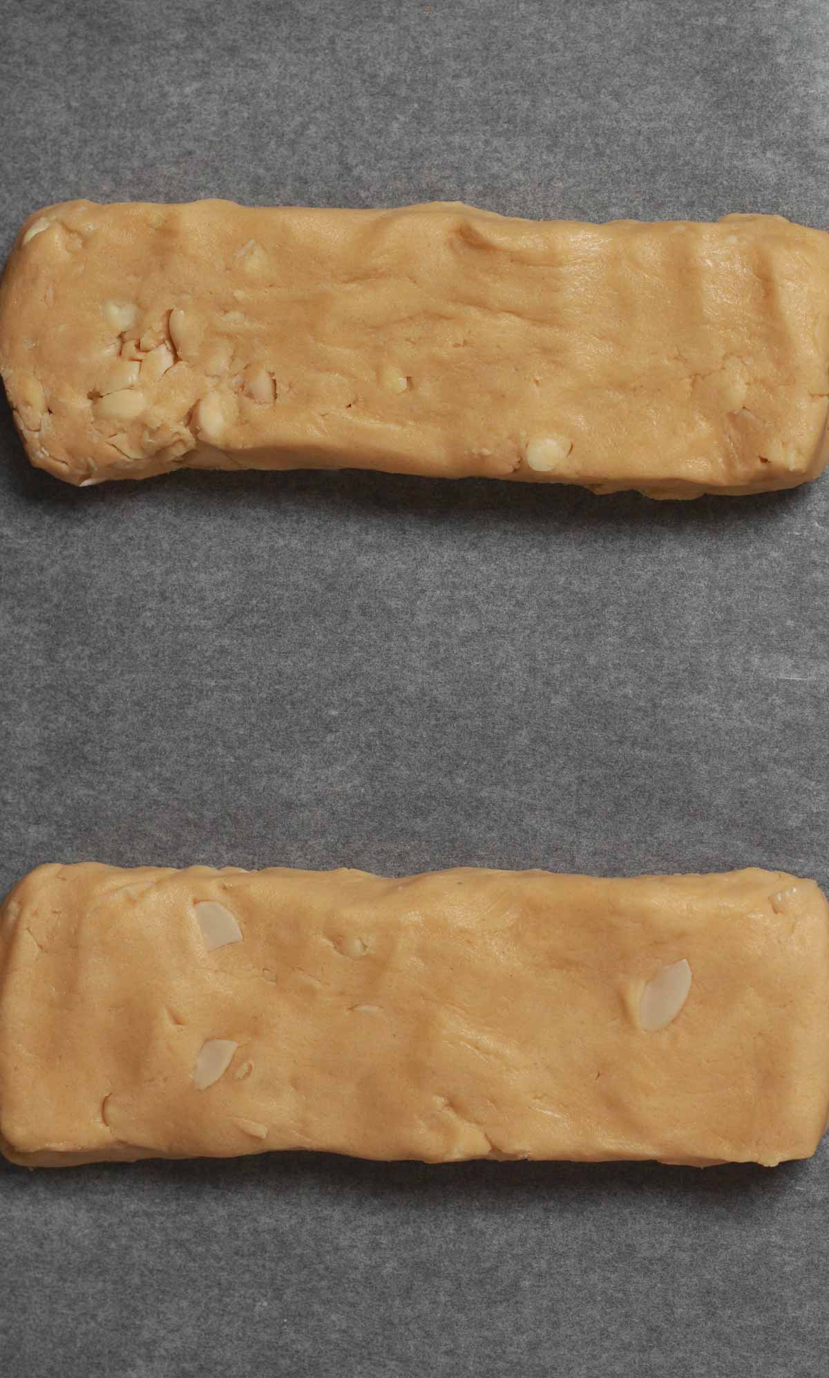 2 Log Shaped Pieces Of Dough On Baking Tray