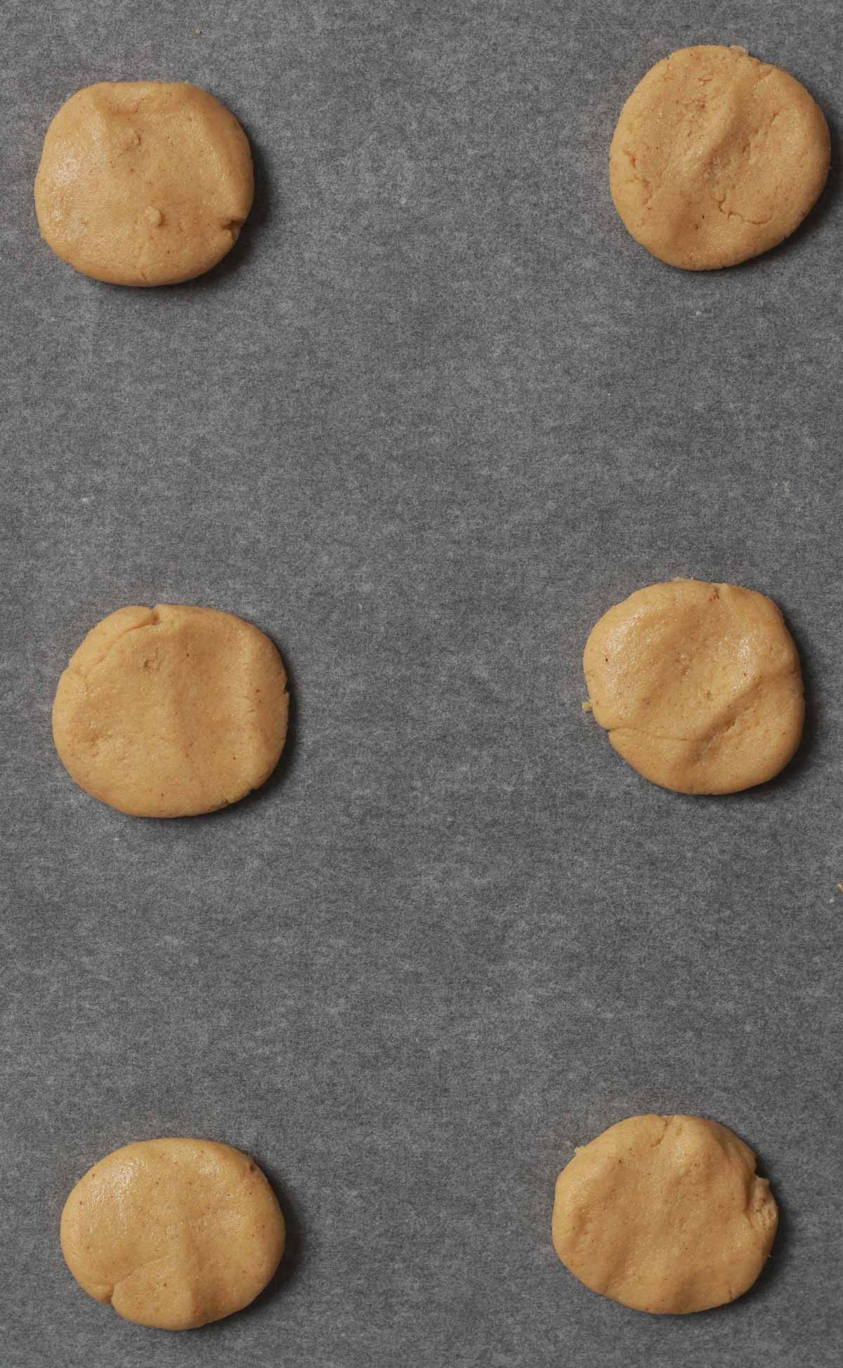 Balls Of Gingersnap Cookie Dough On Baking Tray