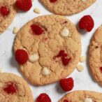 Raspberry White Chocolate Cookies On A White Surface