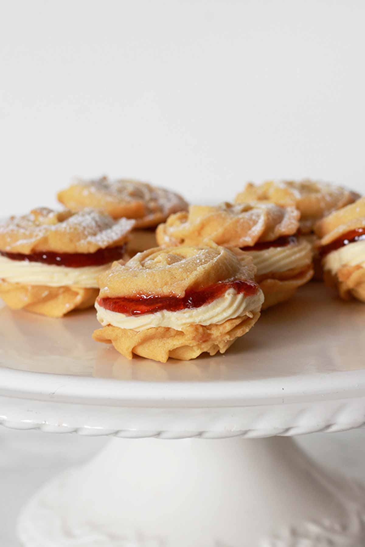 Vegan Viennese Whirls On A White Cake Stand