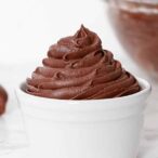 Image of dairy-free chocolate buttercream frosting piped into a white ramekin
