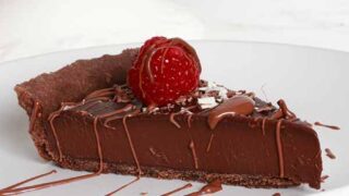 Slice Of Chocolate Tart With Raspberry On Top