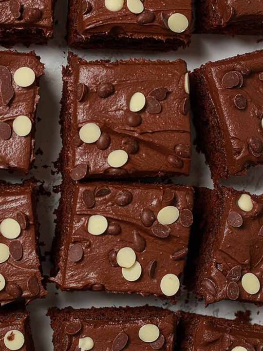 Thumbnail image of vegan chocolate traybake cake cut into slices