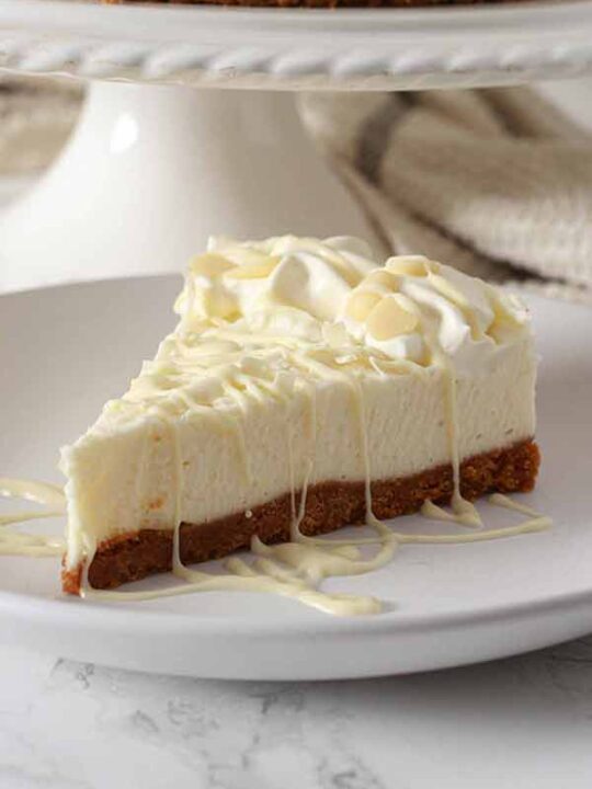 Vegan White Chocolate Cheesecake Slice On Plate
