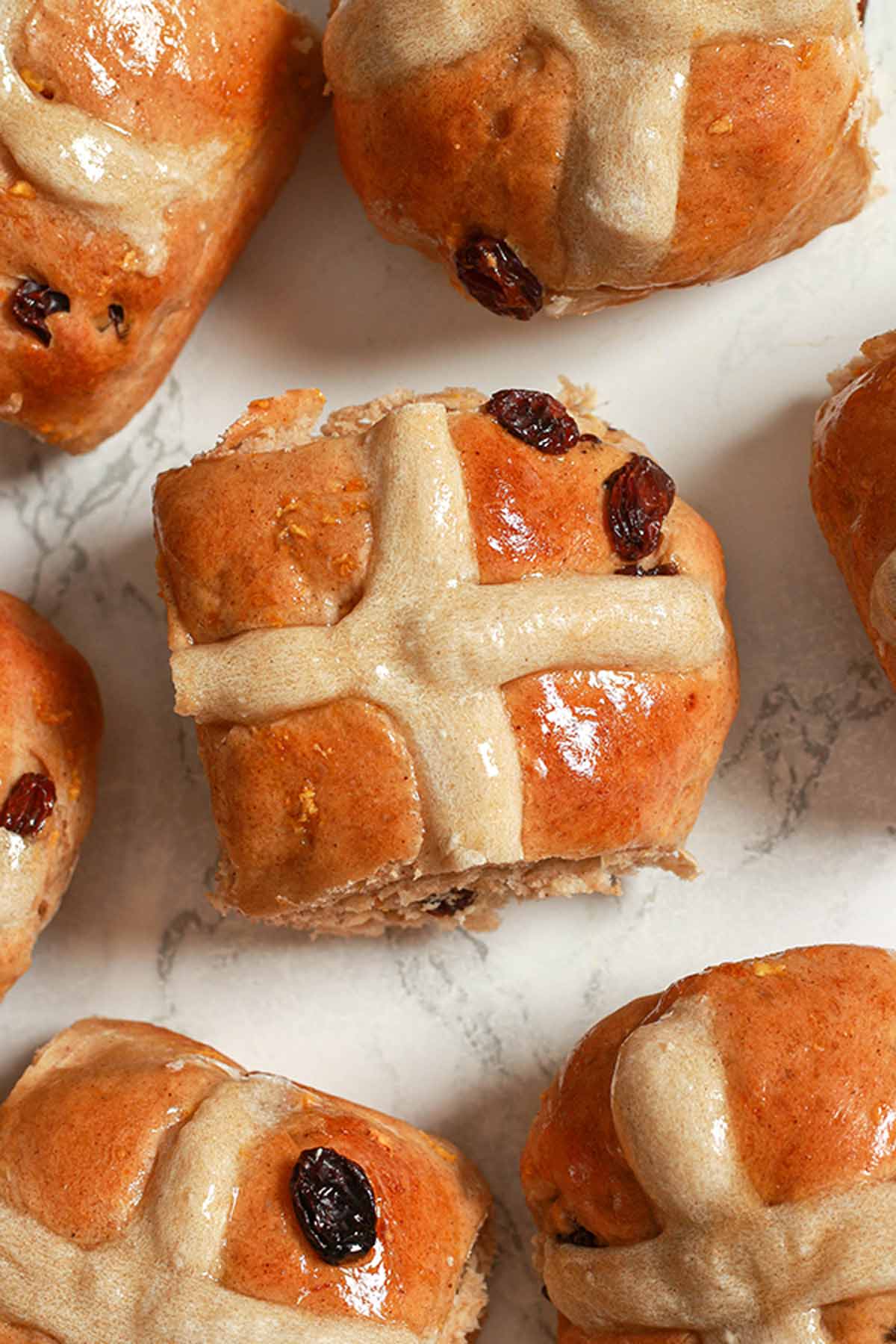 Dairy Free Hot Cross Buns Lying On A White Surface