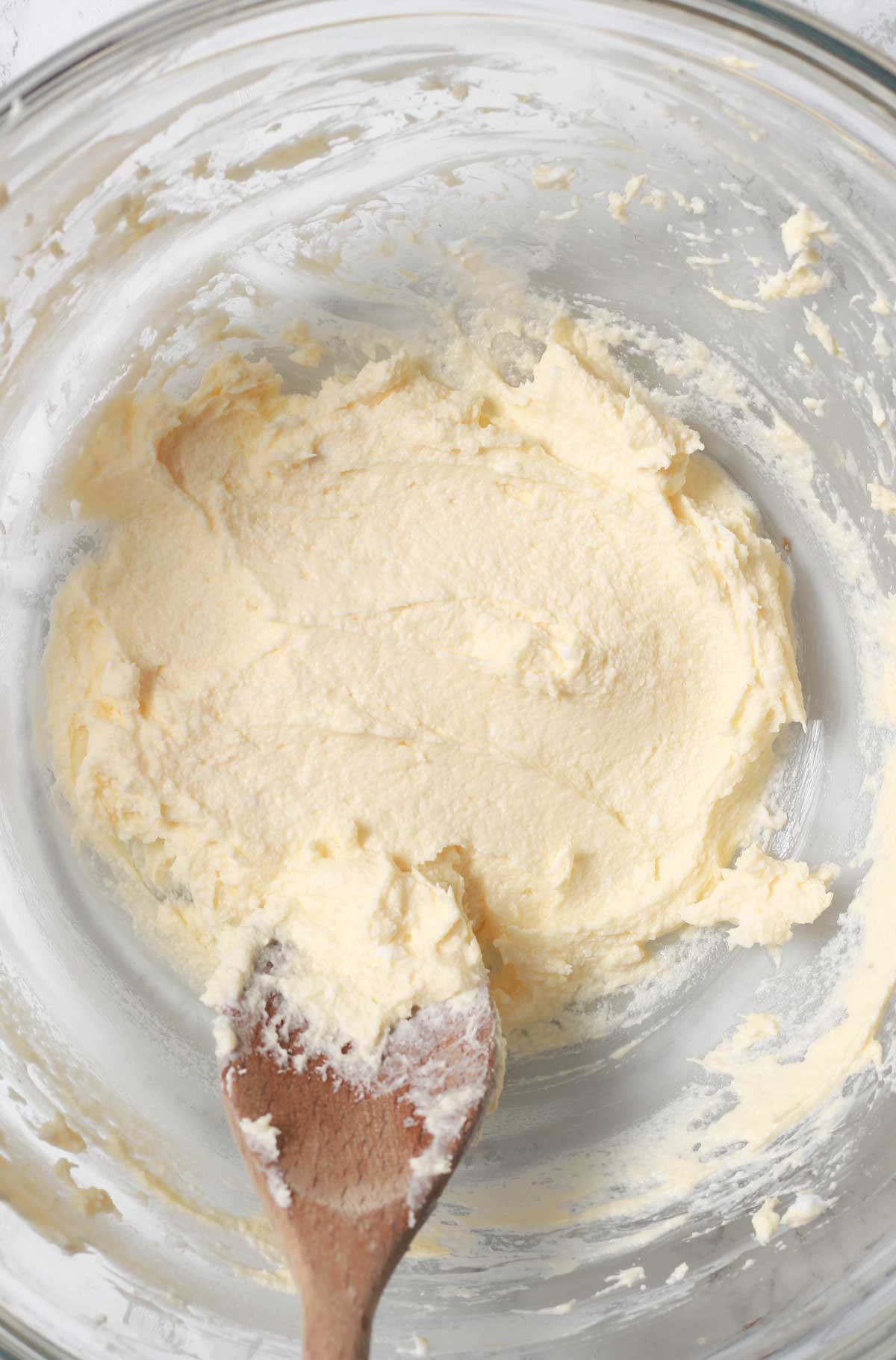 Cream Cheese And Margarine Mixed Together In A Bowl