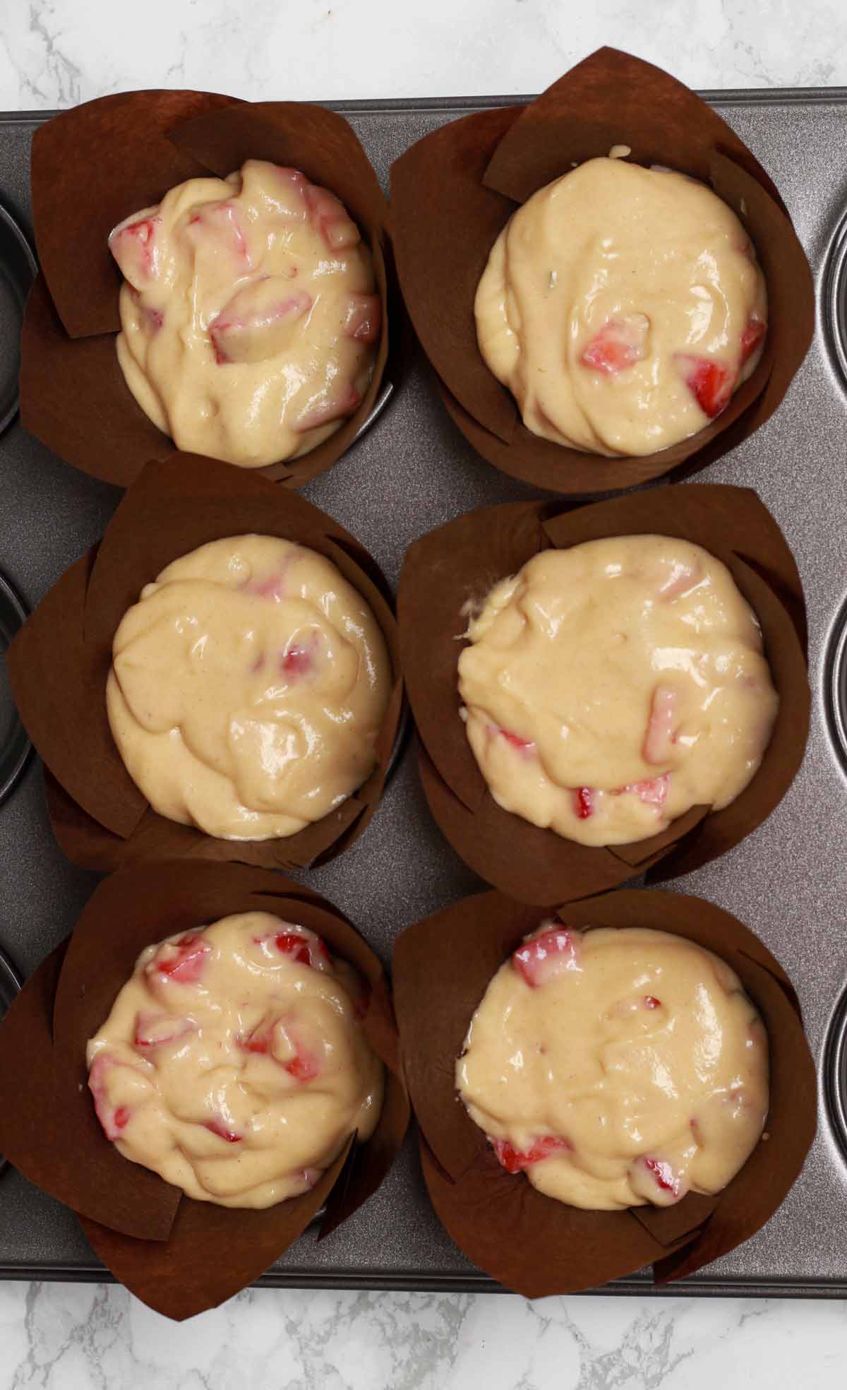 Muffin Batter In Cases Before Baking