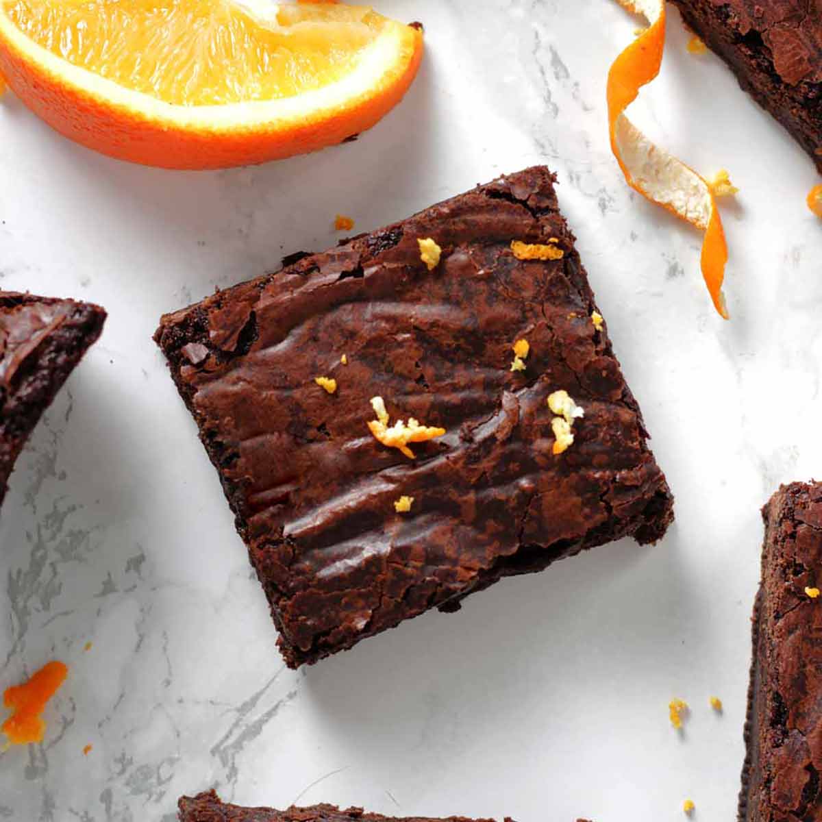 Overhead Shot Of Vegan Chocolate Orange Brownies And An Orange Wedge