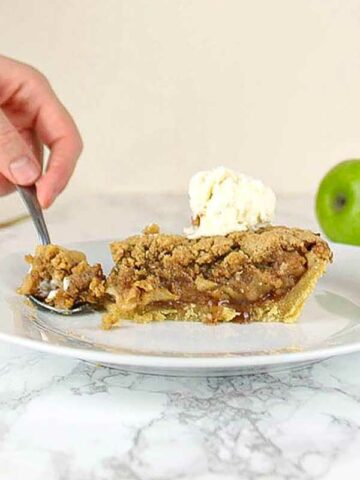 Slice Of Vegan Dutch Apple Pie On A Plate