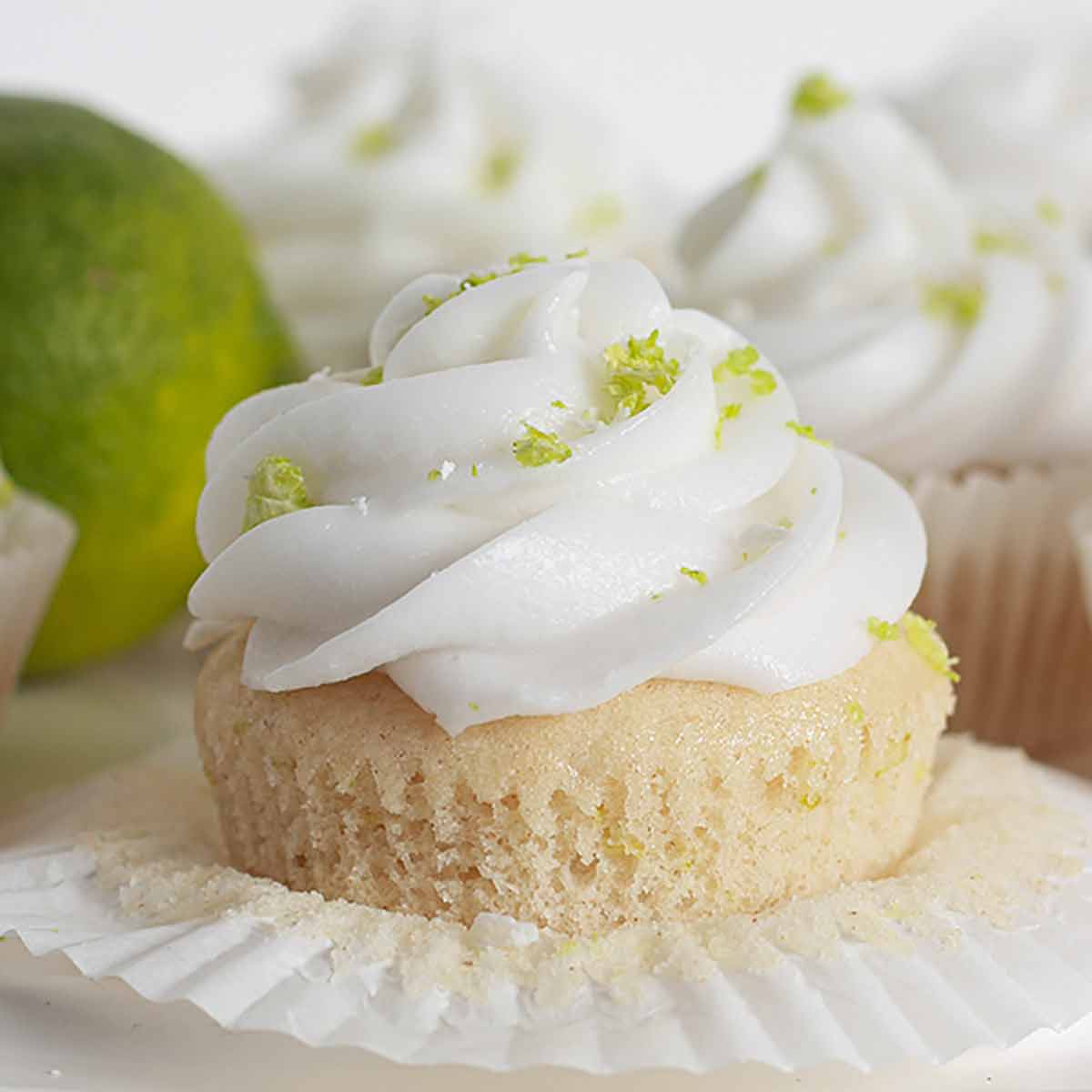 Eggless Lime And Coconut Cupcake On A Cake Stand