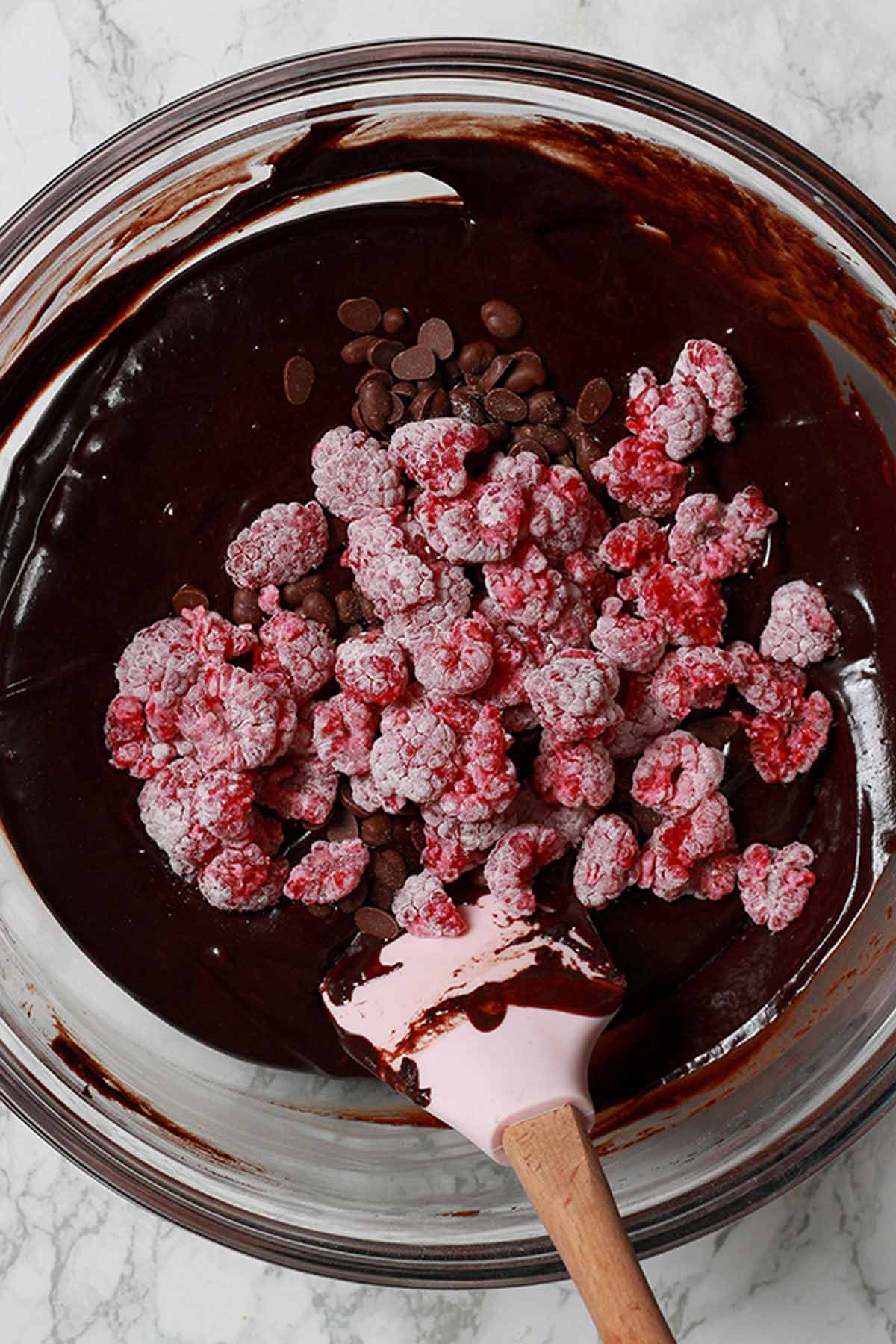 Stirring Raspberries Into The Chocolate Batter