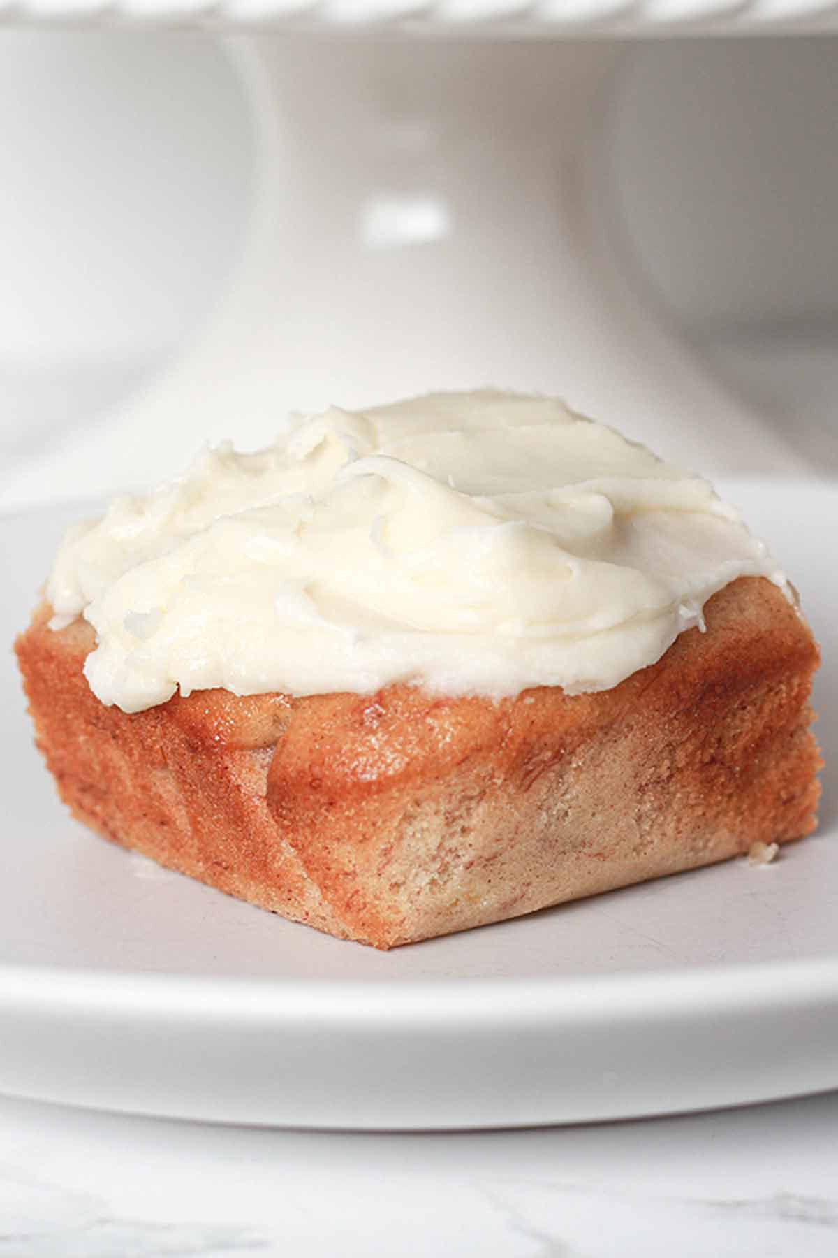 Banana Cake Slice With Cream Cheese Frosting On Top