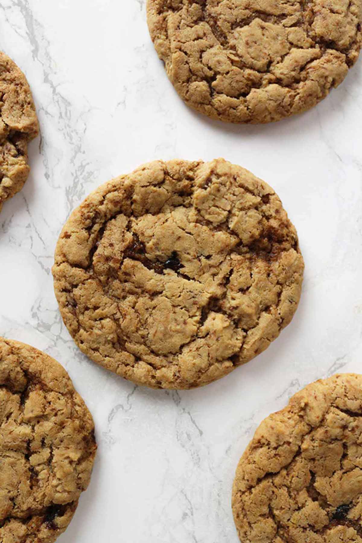 Eggless Ginger Cookies Laying On A White Surface