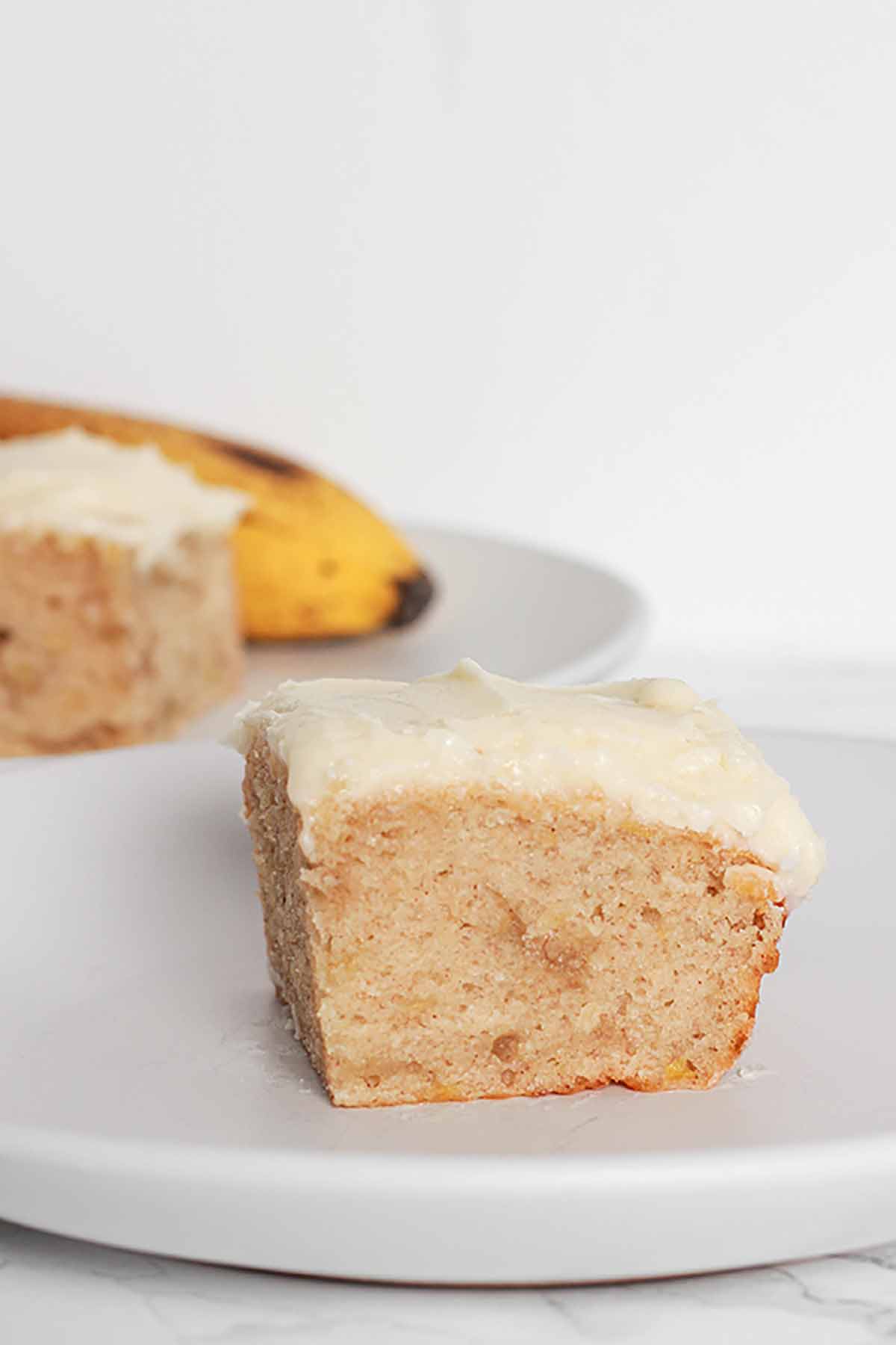 Slice Of eggless Banana Cake On A White Plate vegan thanksgiving dessert