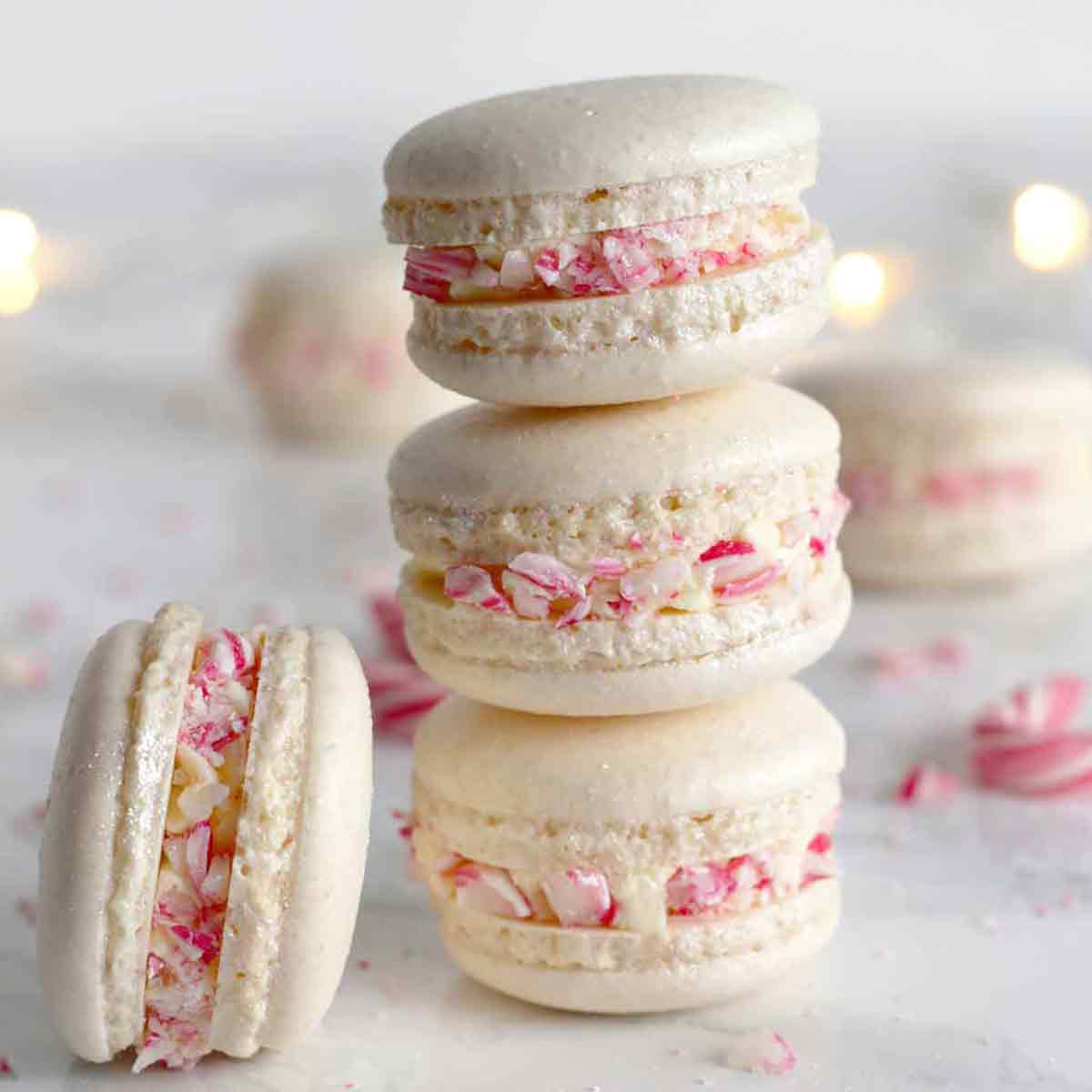 3 Vegan Christmas Macarons Stacked On Top Of One Another