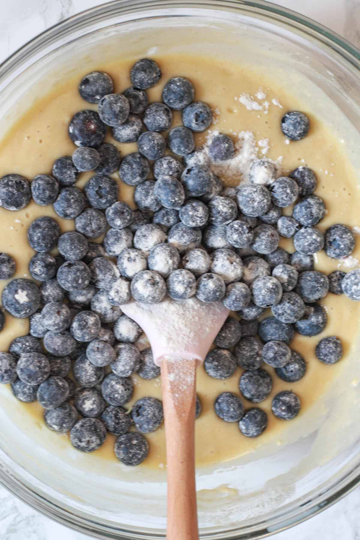 Bowl Of Cake Mix With Flour Covered Blueberries In It