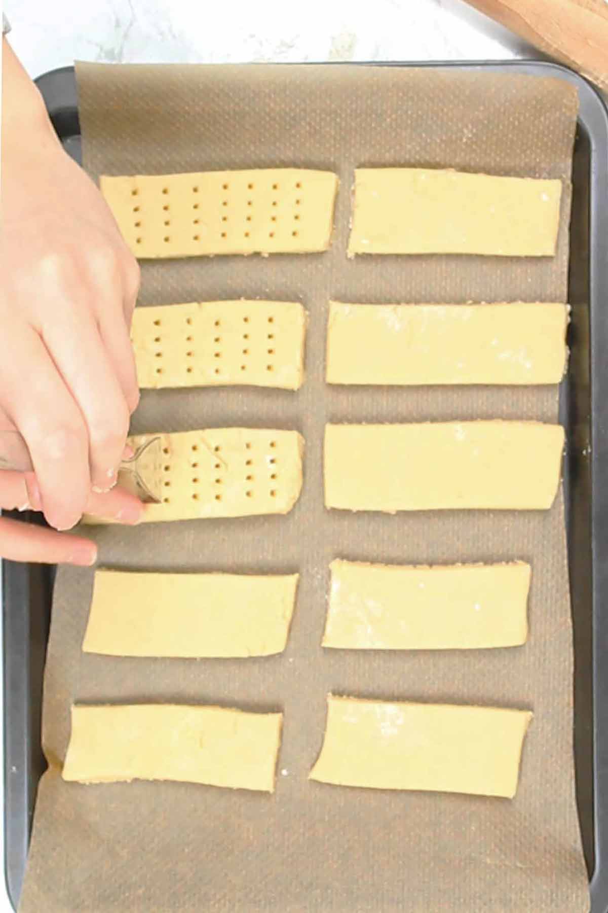 Docking Shortbread Fingers On Baking Tray
