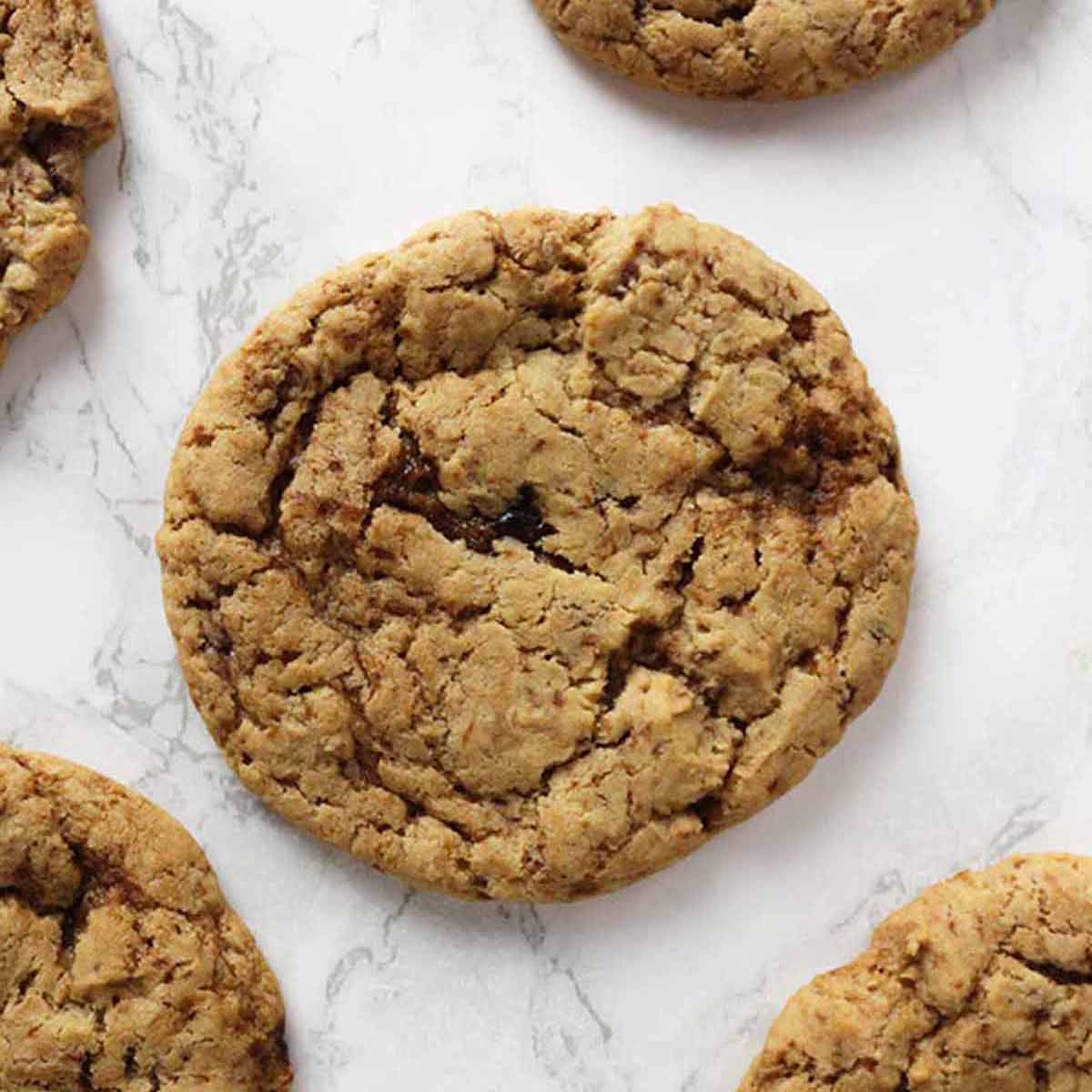 Eggless Ginger Cookies Laying On A White Surface