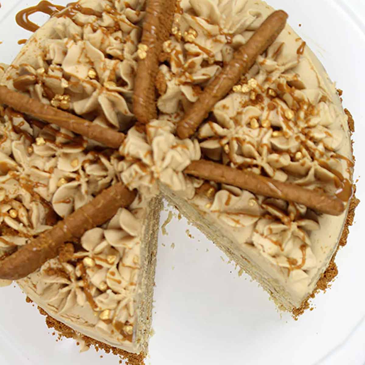 Overhead Shot Of Eggless Biscoff Cake With A Slice Taken Out