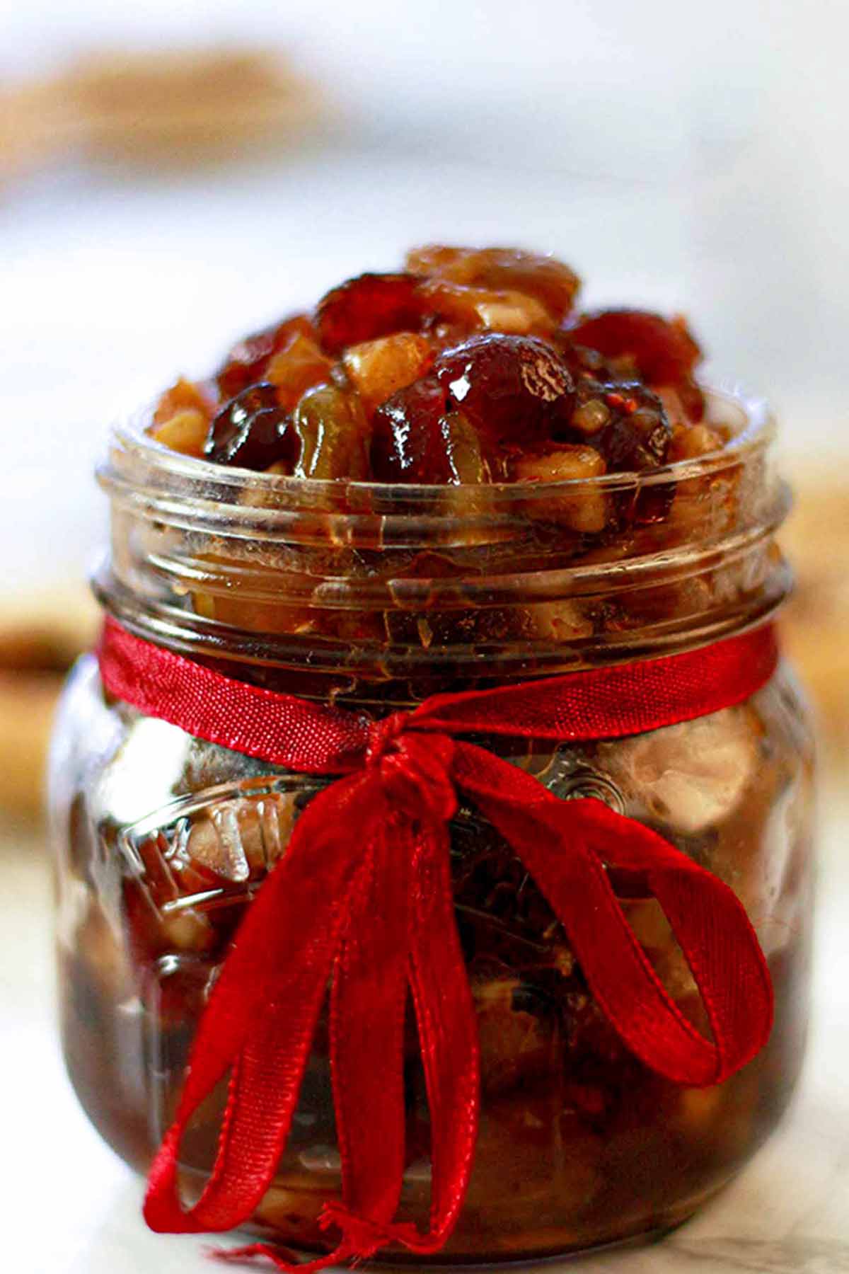 Vegan Mincemeat In A Jar With A Red Ribbon On It
