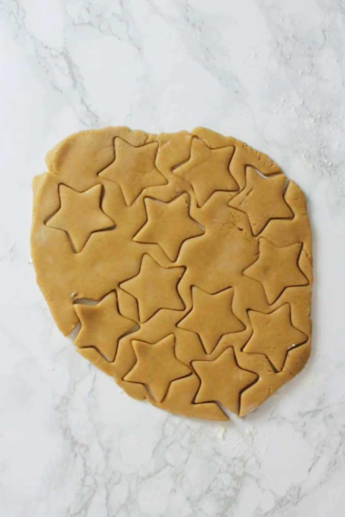 Cutting Out The Dough With A Star Cutter