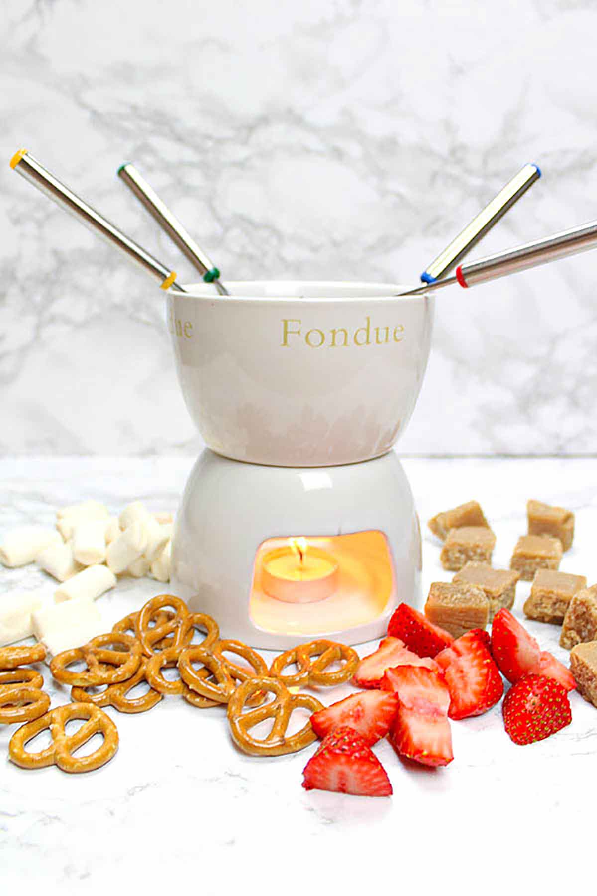 Fondue Pot Surrounded By Dipping Snacks