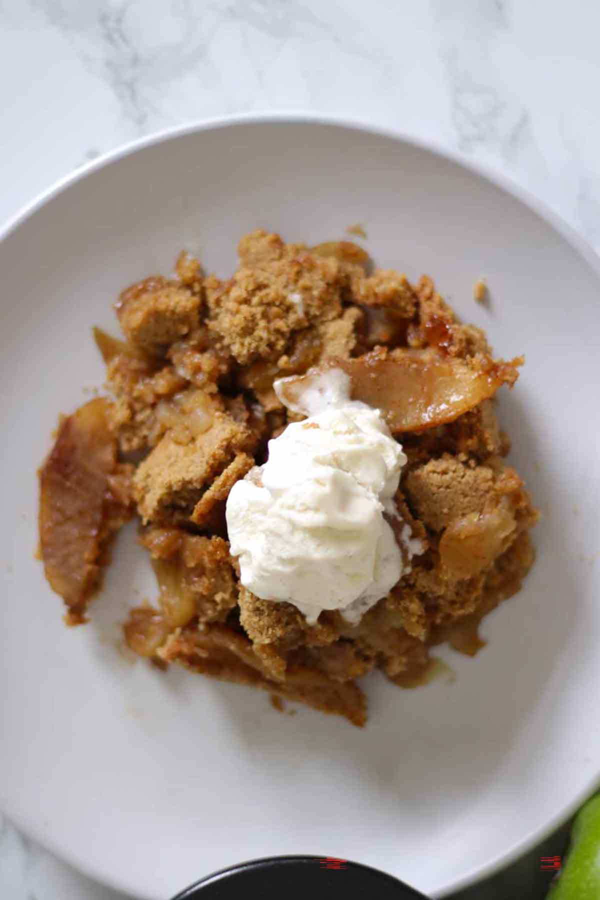 Overhead Shot Of Apple Crumble On A Plate