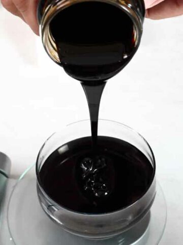 Pouring Molasses Into A Bowl - Is Molasses Vegan