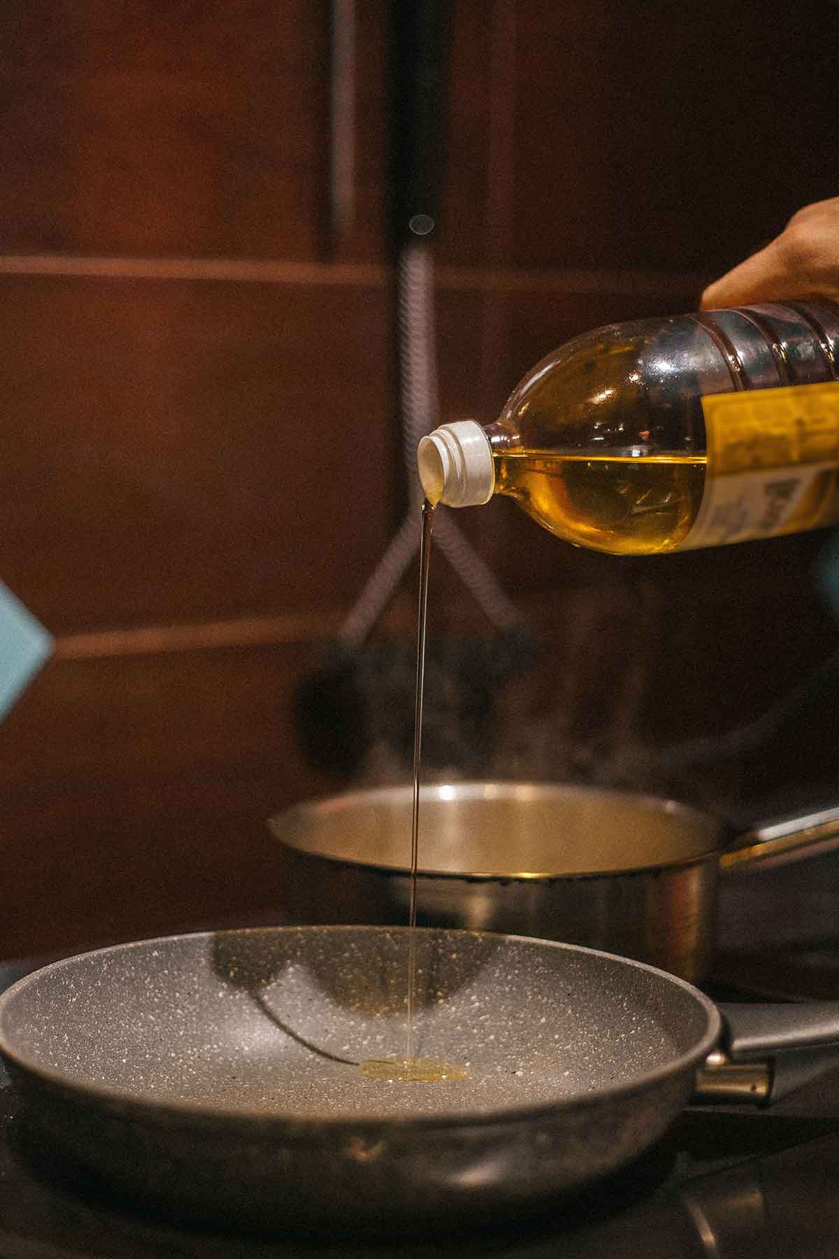 Pouring Oil Into A Pan